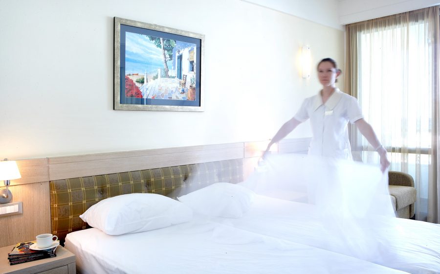 Staff changing sheets of the standard room