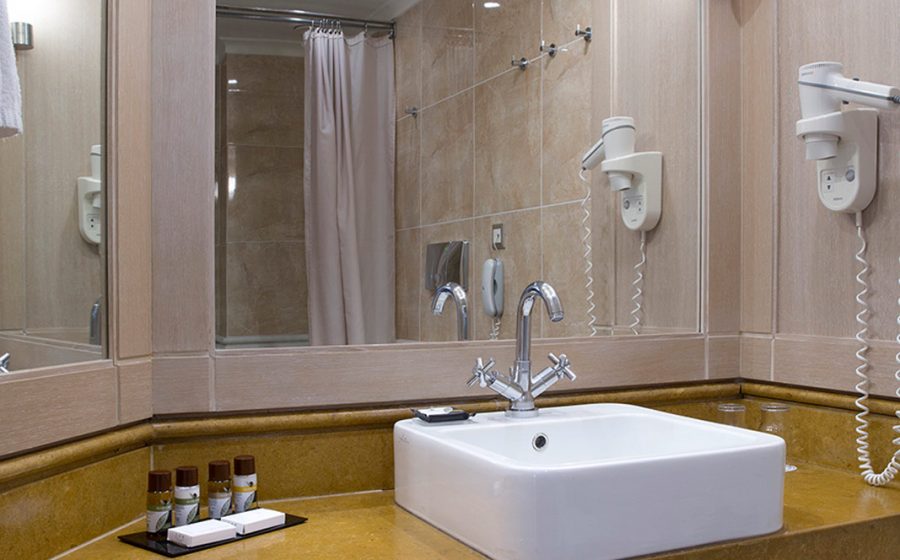 Bathroom mirrors, towels, sampoo and hair drier