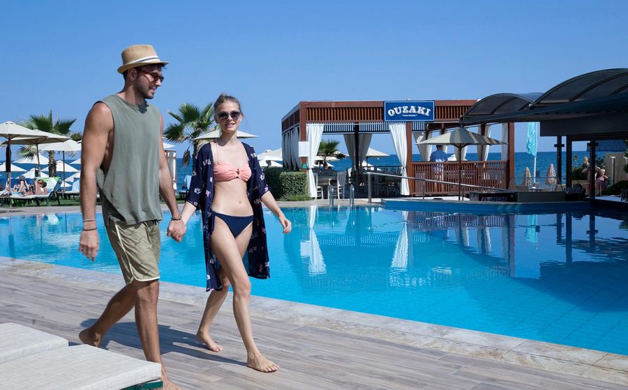 Couple walking by the pool