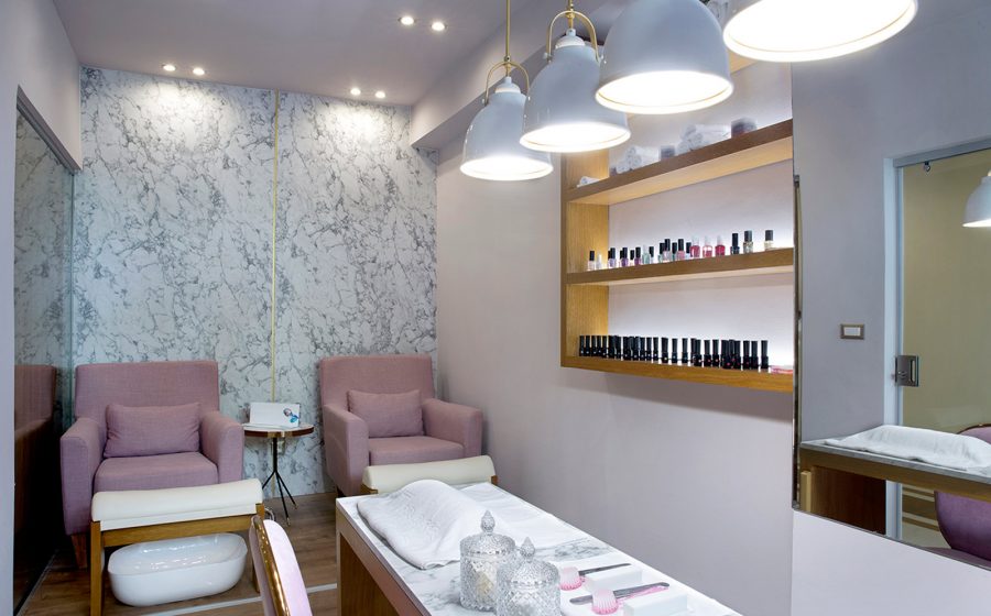 Desk, armchairs and nail health products of spa salon