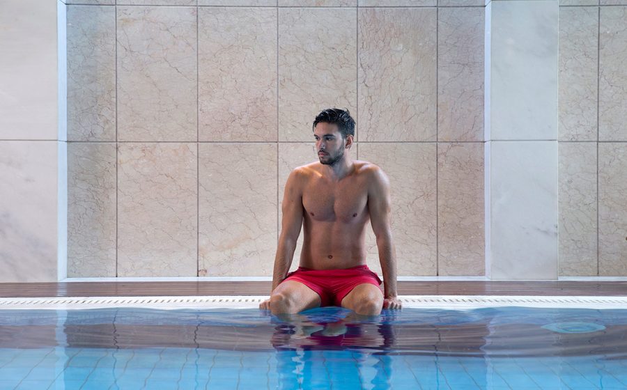 Young man in the spa pool