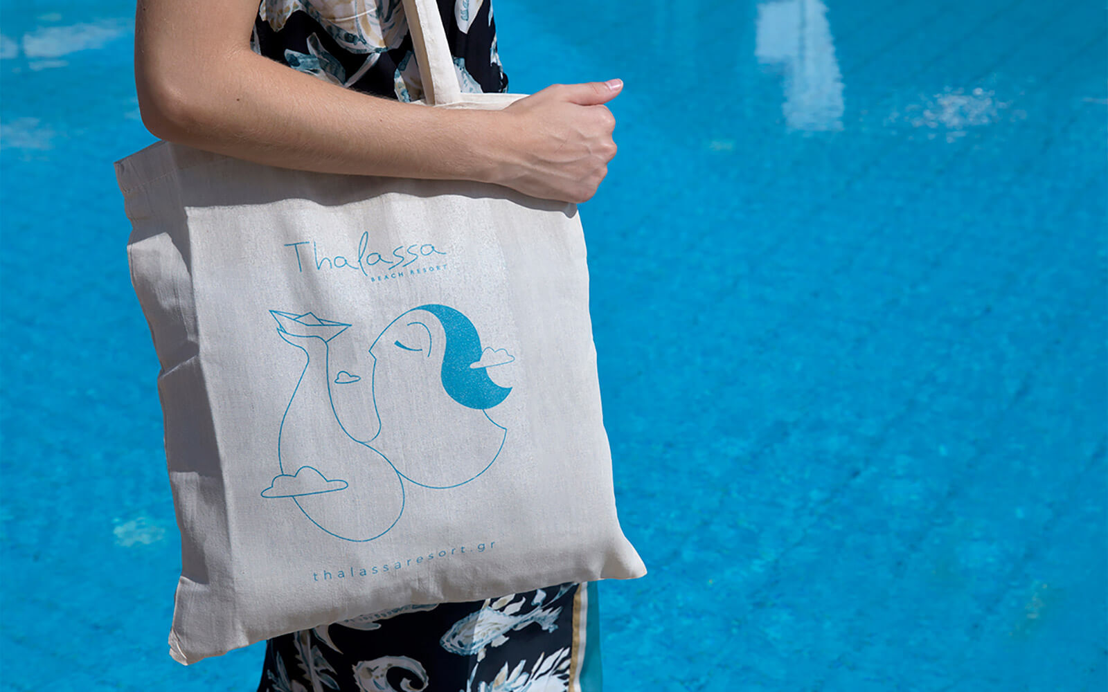 Woman holding bag with thalassa brand 