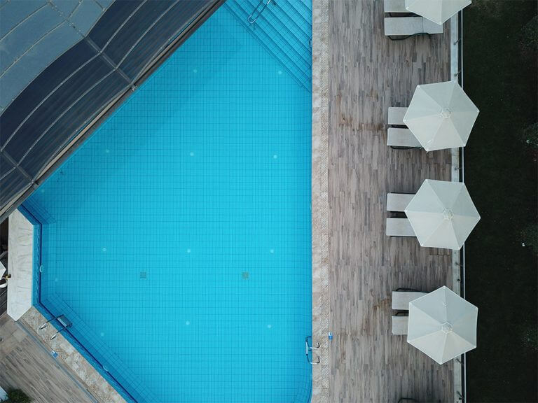 drone view of the pool and sunbeds