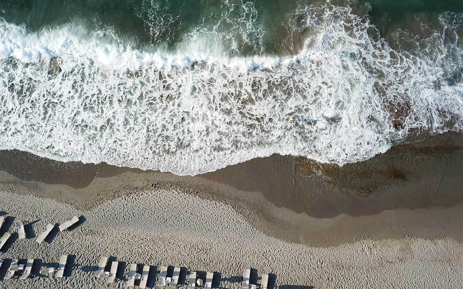 Panoramic view of the beach and sunbeds